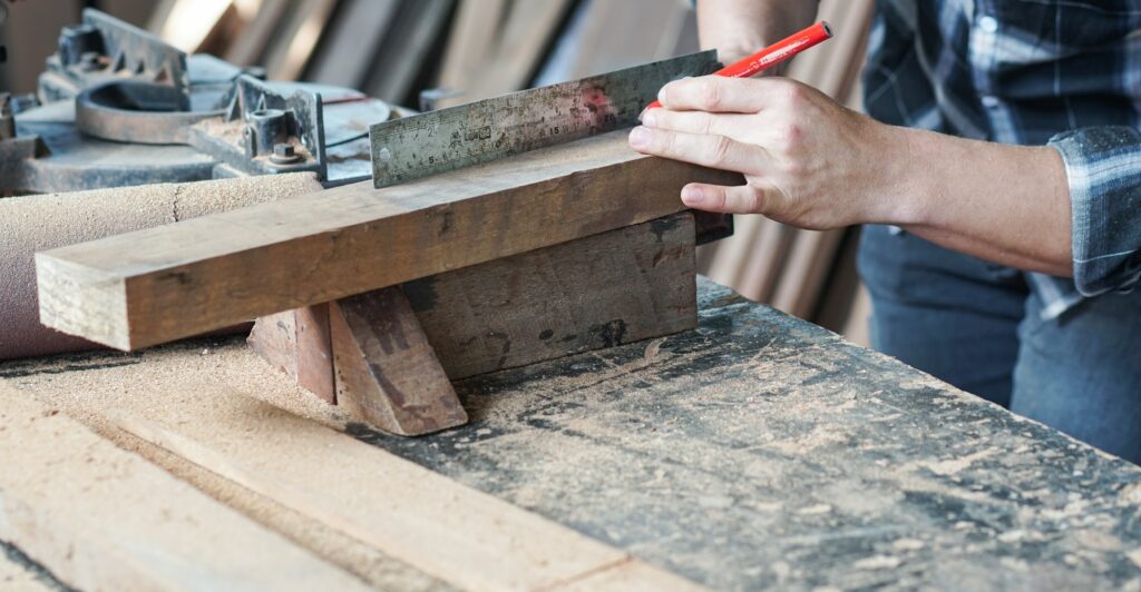 carpenter hand working on woodworking